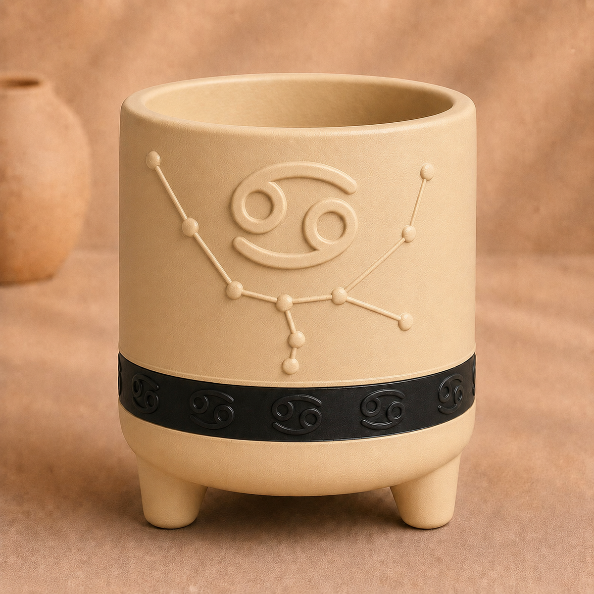 Warm beige Cancer zodiac planter with raised Cancer symbol, constellation, black zodiac band and footed base