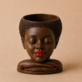 Nayela Afrocentric face planter with short natural hair, stacked hands, red lips, and red nails