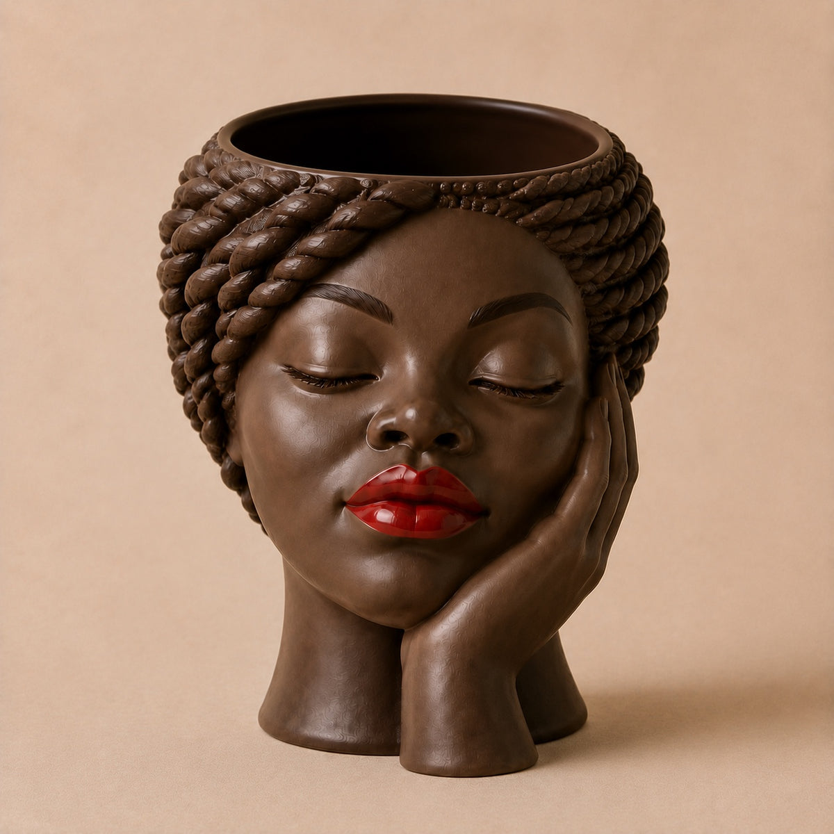 Nia Afrocentric face planter with sculpted braids, resting hand, and red lips